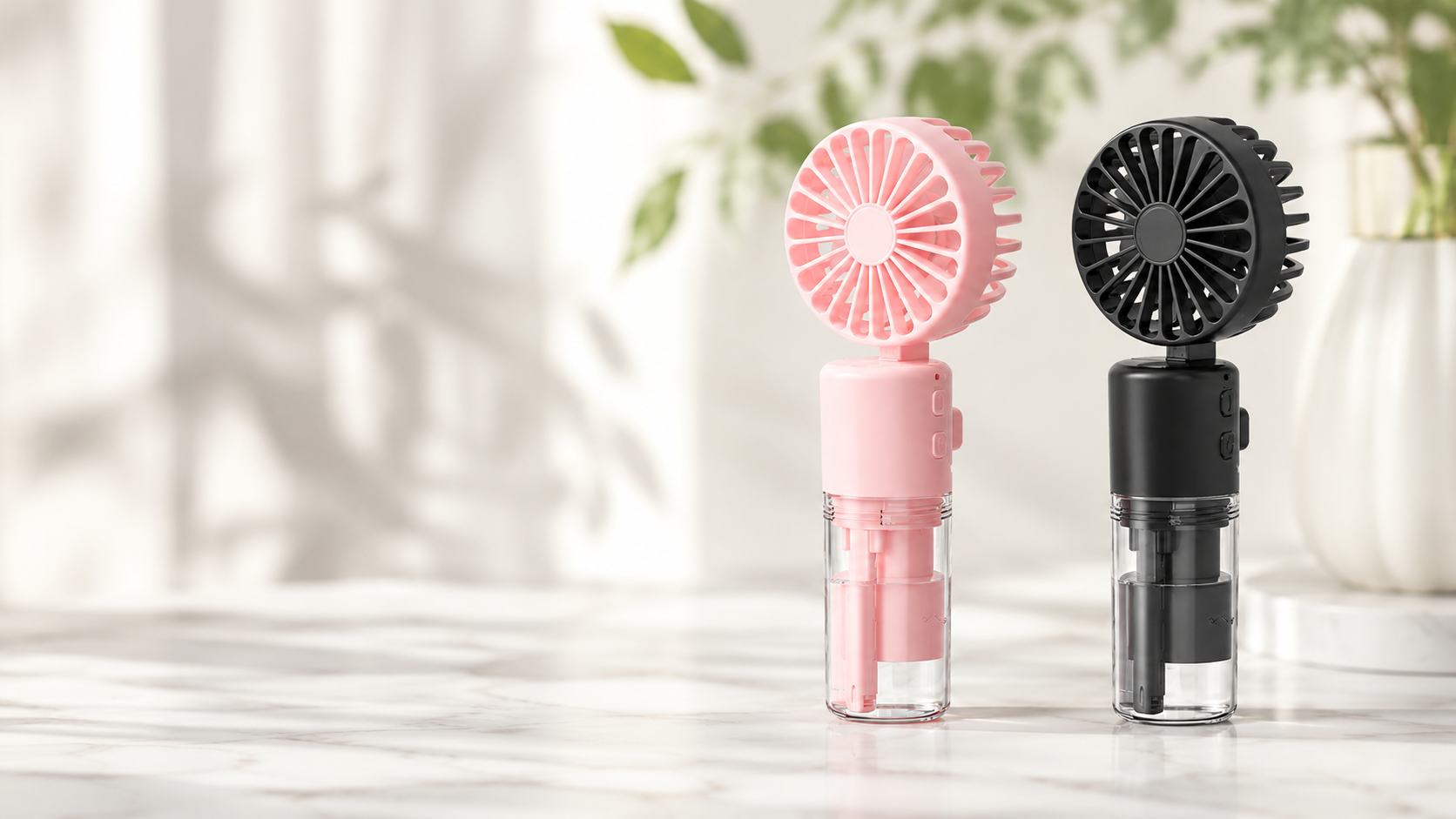 ChillMist Pro pink and black misting fans on a marble counter